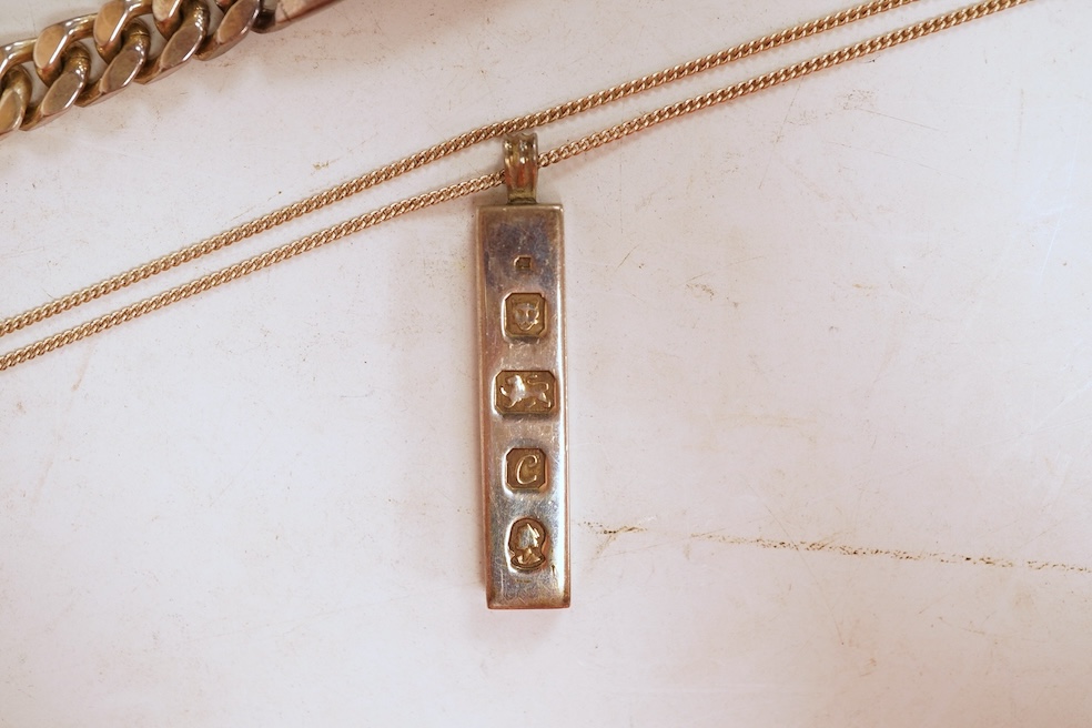 A silver necklace and bracelet, comprising: a silver ingot pendant necklace, pendant length 5.2cm including bail; and a silver curb link ID bracelet, length 20cm, each with British hallmarks, combined gross weight 82 gra